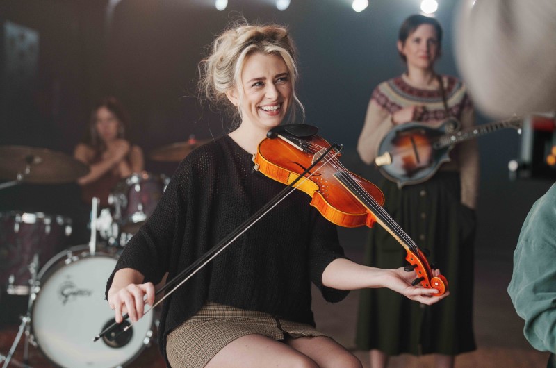 Female and non-binary Scottish musicians playing instruments at the Barrowlands, Glasgow