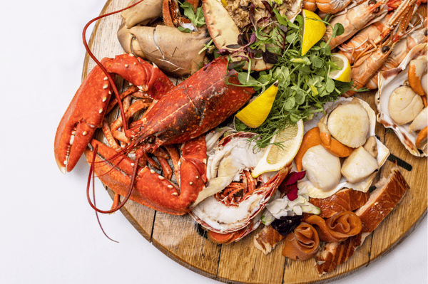 A plate of Scottish seafood on a white background