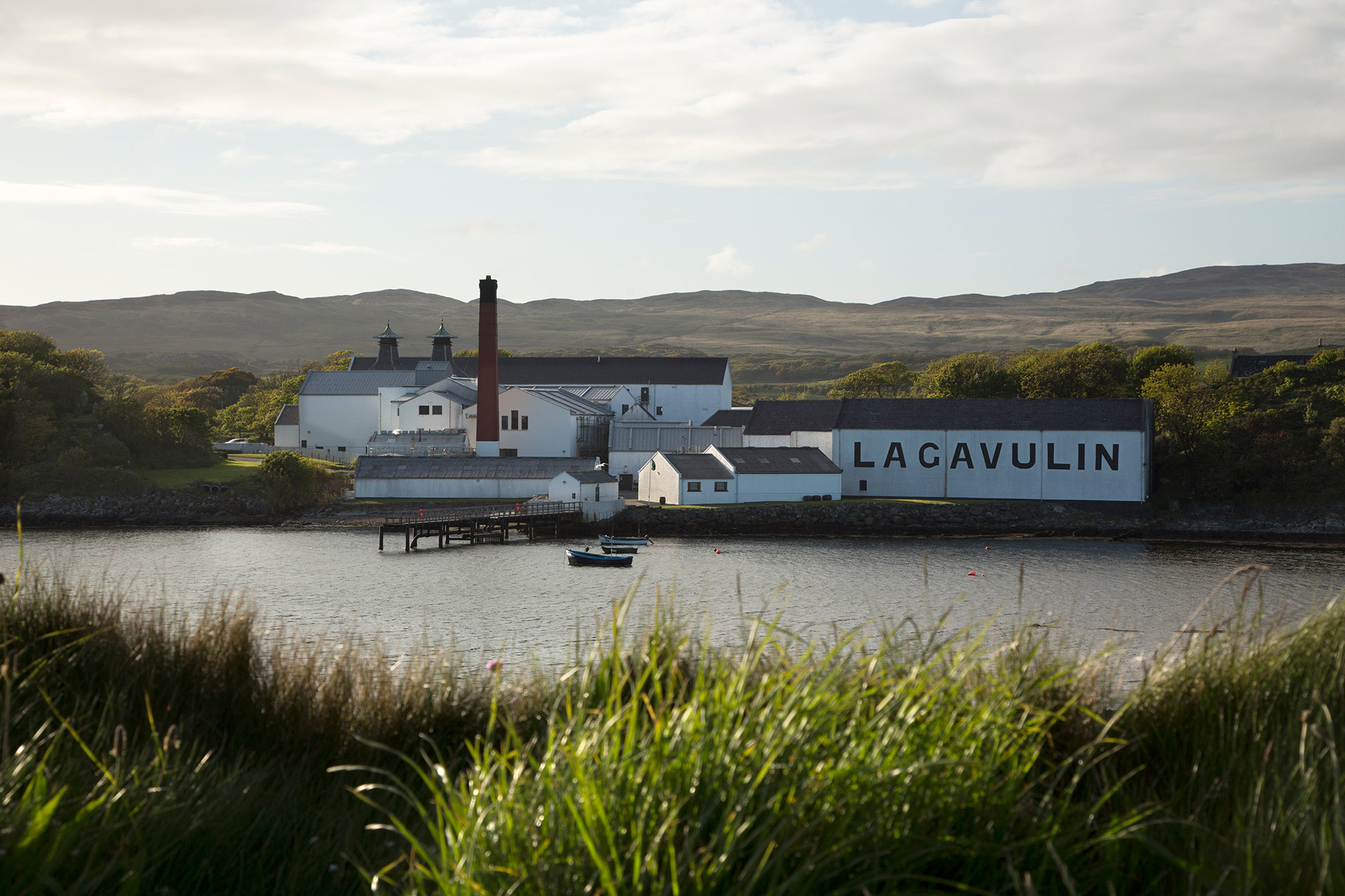 Islay whisky distillery surrounded by water 